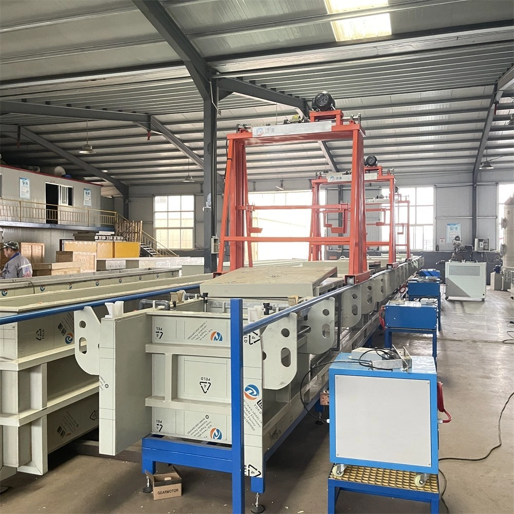 Hanging spray paint line with loaded racks for zipper pullers