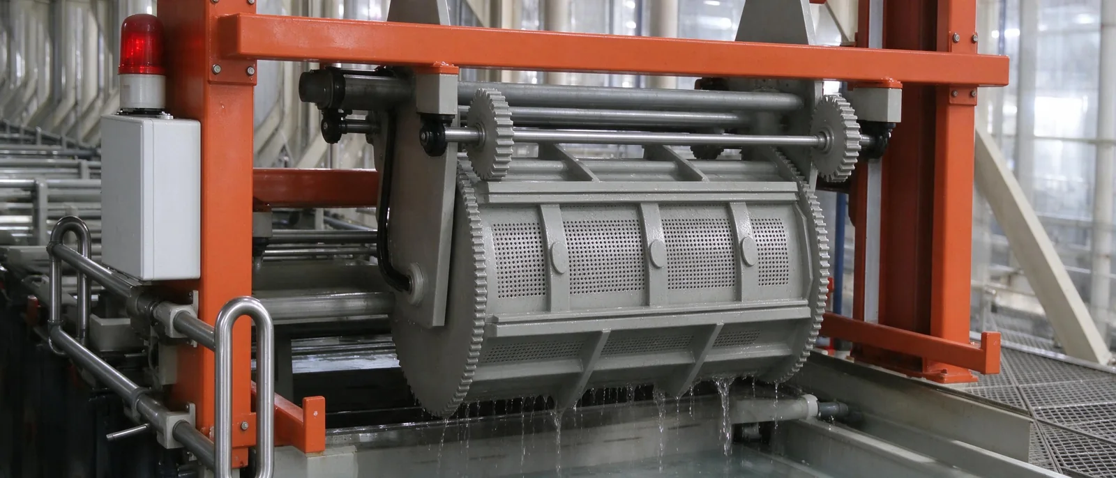 Industrial bright nickel plating roller rotating in a tank on an automated production line