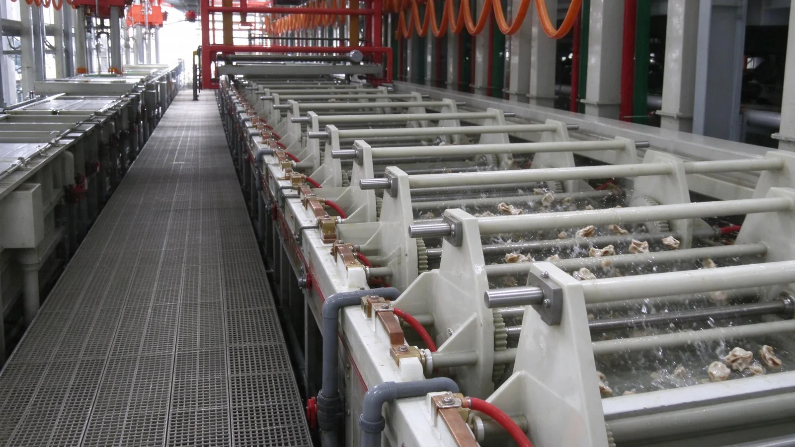 Industrial automated roller conveyor system for transferring workpieces between cleaning and plating tanks