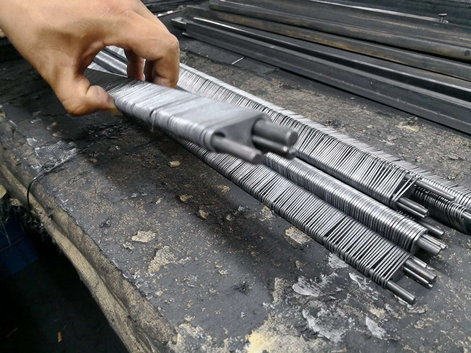 Rack maintenance: stripping and re-coating plating jigs for even contact