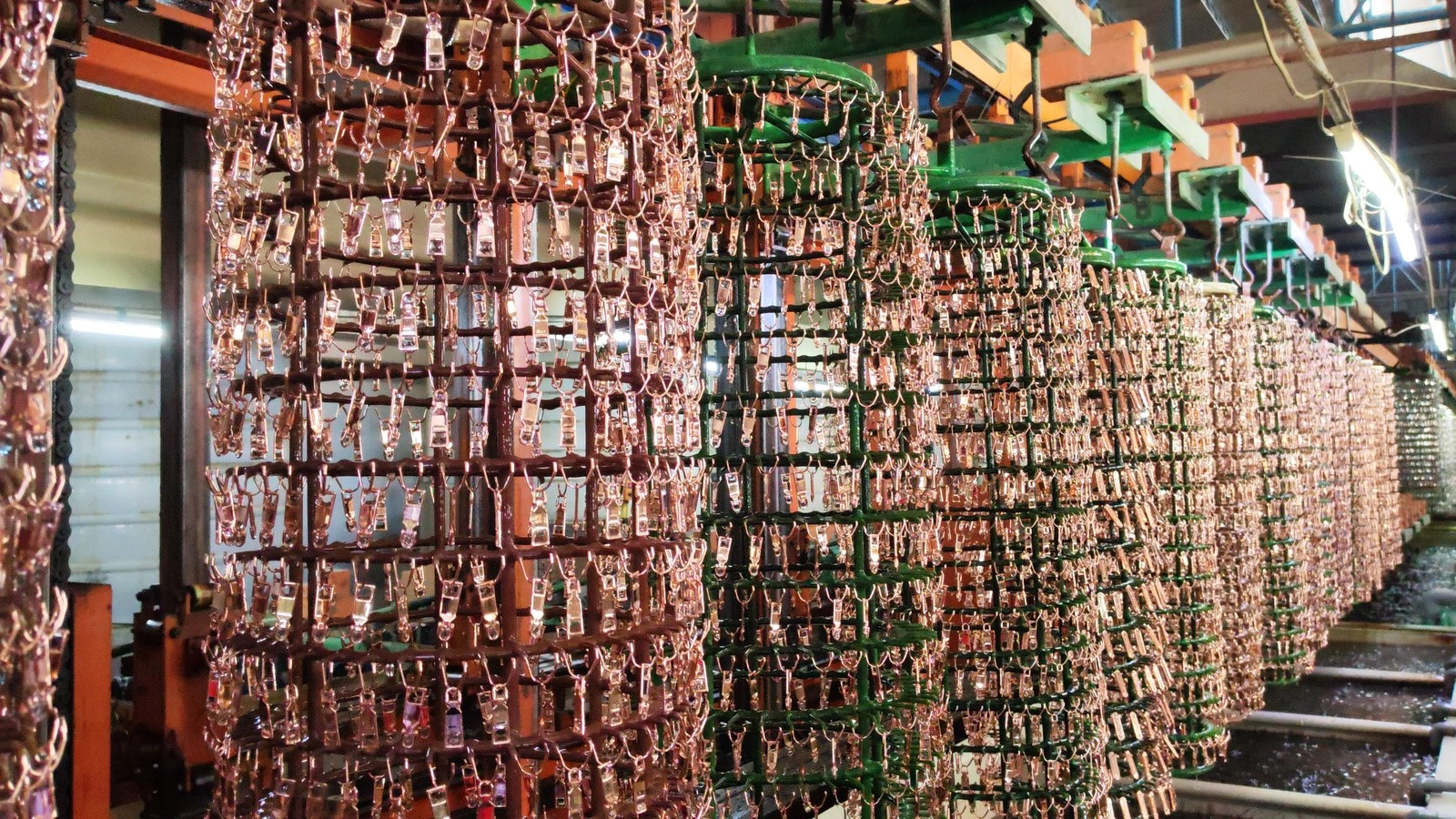 Rack plating line: loaded jigs of zinc alloy parts in the QLQ workshop